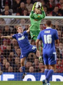 Manchester United’s Spanish goalkeeper David de Gea (center) jumps to claim the ball during the English League Cup third round football match between Manchester United and Ipswich Town at Old Trafford in Manchester, north west England on Thursday. AFP PHOTO