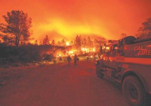 INFERNO RETURNS  Firefighters monitor flames while battling the Butte fire near San Andreas, California on September 12, 2015. According to state fire agency CAL FIRE, the fire has burned more than 65,000 acres and 86 homes. AFP PHOTO