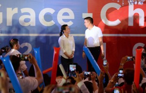 PARTNERS Sen. Grace Poe faces her running mate, Sen. Francis “Chiz” Escudero, during their “coming out” party at Club Filipino. 