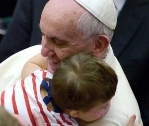 SPREADING KINDNESS  Pope Francis greets a boy during an audience with parish cells for the evangelization in Paul VI hall at the Vatican on September 5, 2015. AFP PHOTO