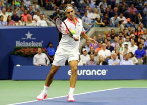 Roger Federer of Switzerland returns a shot to Stan Wawrinka of Switzerland during his men’s singles semifinals match of the 2015 US Open at the USTA Billie Jean King National Tennis Center on Saturday. AFP PHOTO