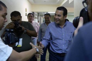 FROM COMIC TO CANDIDATE  Guatemalan presidential candidate for the National Front of Convergence (FCN) party Jimmy Morales, shakes hands with journalists as he arrives for a press conference in Guatemala City on September 5. With Guatemalans increasingly exasperated with politics-as-usual, the long-time frontrunner in the presidential race, right-wing lawyer Manuel Baldizon, has been overtaken by Morales, the comic and political outsider. AFP PHOTO 