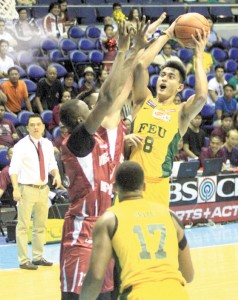 RUN ‘EM OVER Russel Escoto of FEU attempts a jump shot through the defense of Andrew Michael Harris of UP during the UAAP men’s basketball game at the Araneta Coliseum on Wednesday. PHOTO BY MIKE DE JUAN 