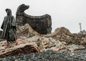 RUINED A boy stands before what remains of the ‘baluarte’ or an early Spanish period watchtower in Luna town in La Union that was destroyed by Typhoon Lando. PHOTO BY LESTER A. CARDINEZ 