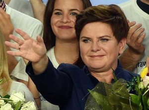 POLAND’S NEW LEADER  Beata Szydlo, candidate for prime minister of the conservative opposition Law and Justice (PiS) celebrates with supporters at the party’s headquarters in Warsaw after exit poll results were announced on October 25. Poland’s conservative Law and Justice (PiS) party won an absolute majority in the general election, public broadcaster TVP projected, a victory that would end eight years of centrist rule. An exit poll showed the PiS picked up 242 out of 460 seats in the lower house of parliament, ousting the governing Civic Platform (PO) liberals who had 133 seats. AFP PHOTO