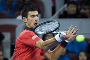 Novak Djokovic of Serbia hits a return against Rafael Nadal of Spain during the men’s singles final at the China Open tennis tournament in Beijing on Monday. AFP PHOTO