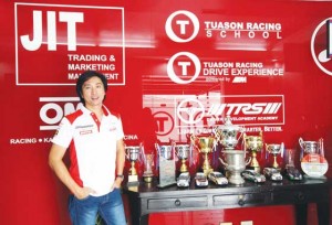 Jean Pierre “JP” Tuason stands beside a Ford Escort RS200 that is similar to the one raced by his father, the late racing legend Arthur Tuason.