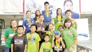 Philippine Swimming League President Susan Papa and Secretary General Maria Susan Benasa with the Most Outstanding Swimmer awardees in the Motivational Division of the 85th Philippine Swimming League (PSL) National Series dubbed as the All-School Swim Challenge held at the Diliman College swimming pool in Quezon City. 