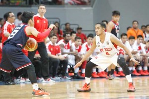 Letran’s Mark Cruz calls the play through the tight defense of San Beda’s Ryusei Koga during Game One of the best-of-three finals of the National Collegiate Athletic Association Season 91 men’s basketball tournament at the Mall of Asia Arena in Pasay City on Friday. PHOTO BY OSWALD LAVINA