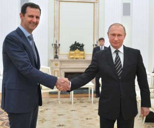 SHOW OF UNITY Russian President Vladimir Putin (R) shakes hands with his Syrian counterpart Bashar al-Assad (L) during a meeting at the Kremlin in Moscow on October 21. Assad, on his first foreign visit since Syria’s war broke out, told his main backer and counterpart Putin in Moscow that Russia’s campaign in Syria has helped contain “terrorism.” AFP PHOTO