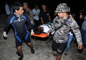 THE LUCKY ONES  Rescuers carry a fisherman, one of those reported missing at sea at the height of Typhoon Kabayan last week, on a stretcher after he and six of his companions were rescued off the waters of Currimao, Ilocos Norte on Saturday. PHOTO BY WILLIAM JUN GARCIA