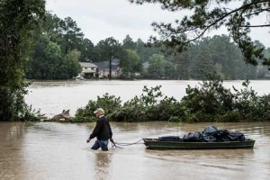 WATERWORLD Eric Van Sant rescues possessions from a flooded home in the Forest Acres neighborhood October 5 in Columbia, South Carolina. The state of South Carolina experienced record rainfall amounts over the weekend, which stranded motorists and residents and forced hundreds of evacuations and rescues. AFP PHOTO