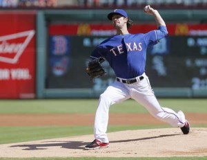 Starting pitcher Cole Hamels no.35 of the Texas Rangers throws during the first inning of a baseball game against the Los Angeles Angels at Globe Life Park on Sunday in Arlington, Texas. AFP PHOTO