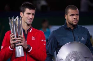 Novak Djokovic (left) of Serbia and Jo-Wilfried Tsonga of France hold their trophies after their men’s singles final match at the Shanghai Masters tennis tournament in Shanghai on Sunday. AFP PHOTO