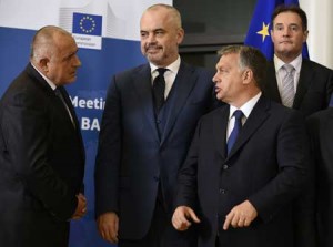 MEN FROM THE EAST Bulgarian Prime Minister Boyko Borisov (L) speaks to Albanian Prime Minister Edi Rama (C) and Hungarian Prime Minister Viktor Orban (R) next to EU border agency Frontex executive director Fabrice Leggeri (back R) as they pose for a family picture during the EU-Balkans mini summit at the EU headquarters in Brussels. European Union and Balkan leaders met to tackle the migrant crisis as Slovenia warned the bloc will “start falling apart” if it fails to take concrete action within weeks. AFP PHOTO