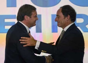 GOOD JOB  Social Democratic Party leader and Prime Minister Pedro Passos Coelho (L) and coalition leader of the Popular Party Paulo Portas congratulate each other at the end of their joint press conference in Lisbon after winning the general elections on October 4. The leader of Portugal’s opposition Socialists, former Lisbon mayor Antonio Costa, conceded defeat in a general election billed as a referendum on four years of harsh austerity policies, as near-complete results gave the ruling center-right coalition a clear lead. AFP PHOTO