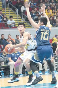 Ed Daquiag (no.8) of the Growling Tigers attempts to go through the defense of Nico Abatayo of the Falcons (no.10) in the University Athletic Association of the Philippines men’s basketball tournament at the Mall of Asia Arena in Pasay City on Saturday. PHOTO BY RUY L. MARTINEZ