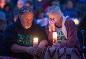 SHOOTING VICTIMS REMEMBERED  Local residents attend a prayer service and candlelight vigil in Winston, Oregon to remember the victims of the mass shooting at Umpqua Community College in nearby Roseburg on October 3, 2015. On Thursday 26-year-old Chris Harper Mercer went on a shooting rampage at the college killing nine people and wounding another nine before killing himself.  AFP PHOTO