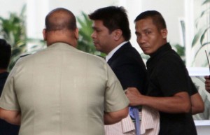 SUBJECT SECURED Security personnel tightly guard defrocked Iglesia Ni Cristo minister Lowell Menorca as he goes inside the chambers of the Court of Appeals. PHOTO BY RENE H. DILAN 