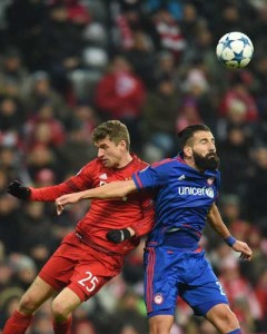 Olympiakos’ defender Dimitris Siovas (right) and Bayern Munich’s striker Thomas Mueller (left) vie for the ball during the UEFA Champions League Group F football match between FCB Bayern Munich and Olympiakos Piraeus on Wednesday at the Allianz Arena in Munich, southern Germany. AFP PHOTO