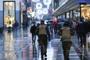 TERROR ALERT Belgian soldiers patrol the Rue Neuve pedestrian shopping street in Brussels on November 21. Brussels was on terror lockdown, with a gunman still on the run after the Paris attacks which have rattled nerves throughout Europe. The Belgian capital closed its metro system and shuttered shopping centers as a terror alert was raised to its highest level over reports of an “imminent threat” of a gun and bomb attack similar to the horror seen in Paris last week. AFP PHOTO