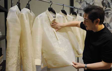 Filipino designer Paul Cabral explains how he designed the ‘barong’ or formal shirts that Asia-Pacific Economic Cooperation (APEC) leaders will wear during the summit this week in Manila AFP PHOTO