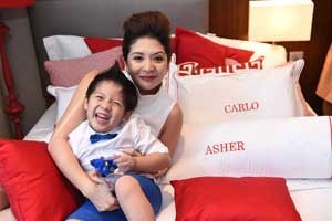 Cat Arambulo-Antonio with her youngest child, three-year-old Asher