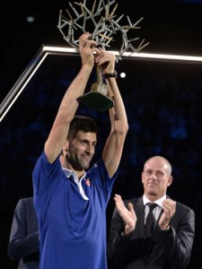 Serbia’s Novak Djokovic poses with the trophy after winning the final tennis match against Britain’s Andy Murray at the ATP World Tour Masters 1000 indoor tennis tournament in Paris on Monday. AFP PHOTO