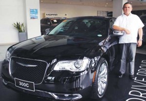 Robert Shaw stands beside one of Chrysler’s bestsellers in the Philippines – the 300C.