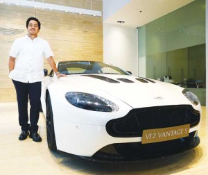 Marc Tagle stands beside the V12 Vantage S, Aston Martin’s most ferocious sport car, inside the Aston Martin  showroom at the BGC in Taguig.