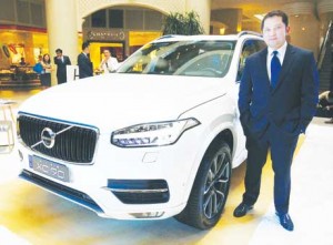 Alberto Arcilla, president and chief executive officer of Scandinavian Motors Corporation, stands beside the XC90 that showcases Volvo’s technologies for its vehicles in the future.