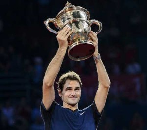 Switzerland’s Roger Federer raises his trophy as he celebrates his victory against Spain’s Rafael Nadal after their final match at the Swiss Indoors tennis tournament on Monday in Basel, northern Switzerland. AFP PHOTO