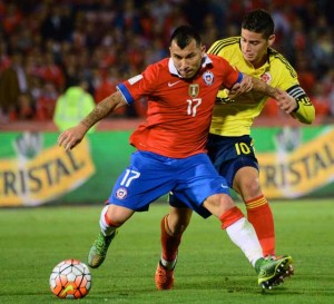 Chile’s Gary Medel (left) vies for the ball with Colombia’s James Rodriguez during their Russia 2018 FIFA World Cup South American Qualifiers football match, in Santiago, on Friday. AFP PHOTO