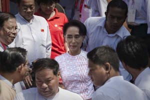 PROJECTED WINNER  Myanmar opposition leader Aung San Suu Kyi (C) leaves the headquarters of the National League of Democracy (NLD) after she made a speech to a small crowd and the media in Yangon on November 9. Vote counting in Myanmar’s landmark election was well underway following a massive turnout that could see Aung San Suu Kyi’s party catapulted to power and the end of decades of military control. AFP PHOTO