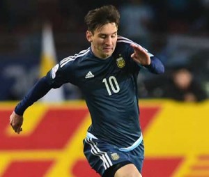 Argentina’s forward Lionel Messi (top) and Uruguay’s midfielder Egidio Arevalo Rios vie for the ball during their 2015 Copa America football championship match, in La Serena, Chile. AFP FILE PHOTO