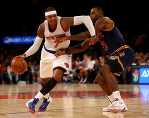 Carmelo Anthony No.7 of the New YorkKnicks tries to get around LeBron JamesNo.23 of the Cleveland Cavaliers in the fourthquarter at Madison Square Garden onSaturday in New York City.  AFP PHOTO