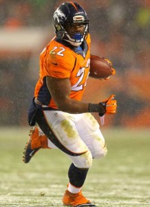 Running back C.J. Anderson No.22 of the Denver Broncos rushes for a touchdown against the New England Patriots in the fourth quarter at Sports Authority Field at Mile High on Sunday in Denver, Colorado. AFP PHOTO