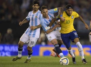 Argentina’s Lucas Biglia(center) and Brazil’s Neymarvie for the ball during theirRussia 2018 FIFA World CupSouth American Qualifiersfootball match, in BuenosAires, on Saturday.AFP PHOTO