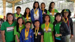 Philippine Swimming League (PSL) President Susan Papa and Secretary General Maria Susan Benasa with the Most Outstanding Swimmer awardees in the 86th PSL National Series in Baguio City. CONTRIBUTED PHOTO