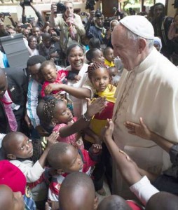 This handout picture released by the Vatican press office shows Pope Francis during a visit in the Kangemi slum of Nairobi as part of his trip in Africa. AFP PHOTO