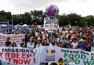 CALL FOR CHANGE  Climate advocates, members of religious, labor and youth groups converge at the Quezon City Memorial Circle to demand curbs on emissions. PHOTO BY MIKE DE JUAN