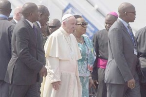 WARM WELCOME  Pope Francis walks after being welcomed by interim leader of the Central African Republic, Catherine Samba Panza. AFP PHOTO