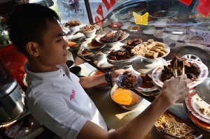 , a restaurant employee prepares rendang, a traditional West Sumatranese meat cuisine, in Jakarta. AFP FILE PHOTO