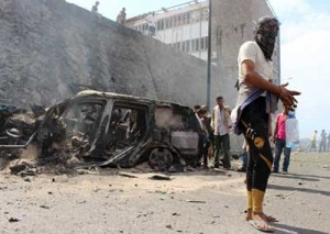 ADEN GOVERNOR ASSASSINATED  Yemen is gather around the wreckage of a car at the site of a blast that hit the convoy of the governor of Aden, Jaafar Saad, in the Tawahi neighborhood of the Yemeni port city of Aden, on December 6. A car bombing claimed by the Islamic State (IS) group killed the governor of Yemen’s second city, a day after the UN’s envoy visited to press for longdelayed peace talks. AFP PHOTO