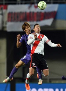 River Plate forward Lucas Alario (right) fights for the ball with Sanfrecce Hiroshima defender Sho Sasaki (left) during their Club World Cup semifinals football match in Osaka on Wednesday. AFP PHOTO 