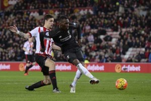 Liverpool’s Zaire-born Belgian striker Christian Benteke (right) scores the opening goal during the English Premier League football match between Sunderland and Liverpool at the Stadium of Light in Sunderland, north east England, on Thursday. AFP PHOTO