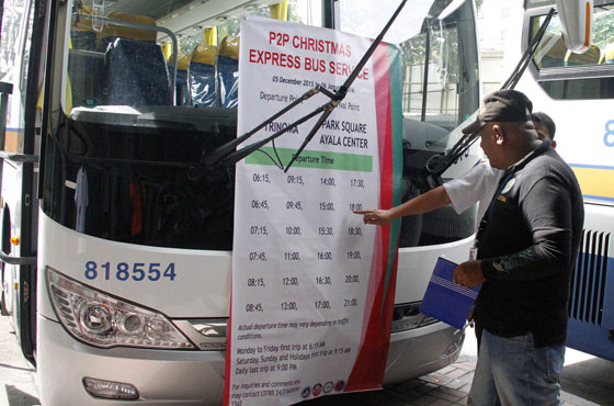 Benigno Geneza, an inspector of the Land Transport Franchising and Regulatory Board inspects one of 20 express buses parked near Trinoma in Quezon City. The buses will be deployed during the holidays to help ease the Christmas gridlock. PHOTO BY MIKE DE JUAN 