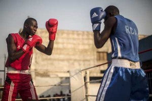 Boxers fight in the flashpoint Muslim district of Bangui known as PK5, where Muslims and Christian boxers fought a tournament to support a peace initiative through sport. AFP PHOTO