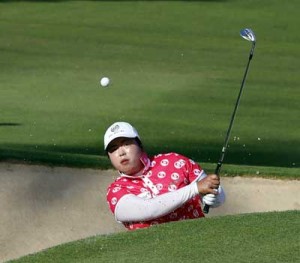 Shanshan Feng of China plays a shot during the third round of the Dubai Ladies Masters in Dubai. AFP PHOTO