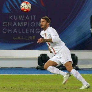 English footballer David Beckham eyes the ball during a ceremonial football match between Kuwait all-stars team and Football Champions Tour Legends on Friday, as part of the inauguration ceremony of the Jaber Al-Ahmad International Stadium in Kuwait City. AFP PHOTO